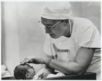Dr. Virginia Apgar examining a newborn